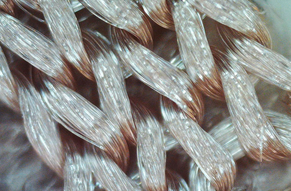 Waste PET fabric metallized with catalytic gold nanoparticles, visible as brown areas
